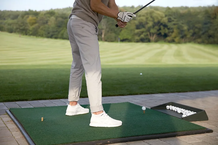Golfer swinging his golf club